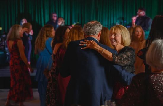 Guests dancing during a celebration in the Juniper Room